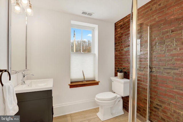 full bathroom featuring a stall shower, brick wall, visible vents, and vanity