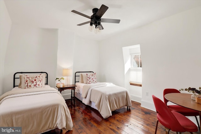 bedroom featuring a ceiling fan, wood-type flooring, and baseboards