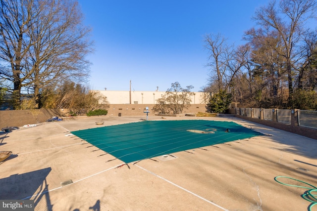 view of pool featuring a patio area, fence, and a fenced in pool