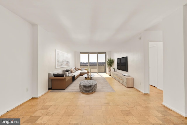 living room featuring baseboards