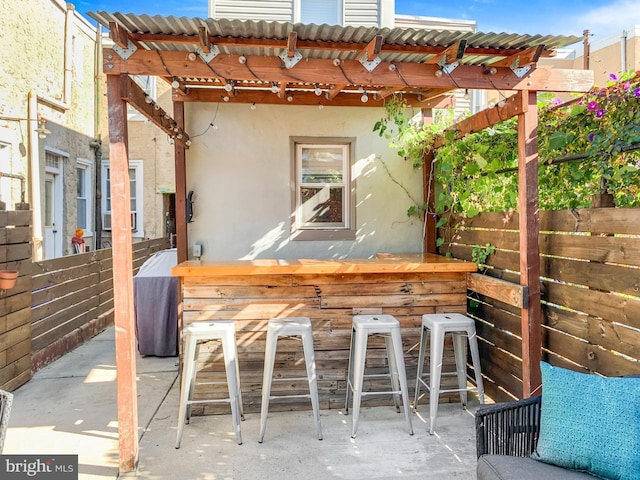 view of patio with outdoor dry bar