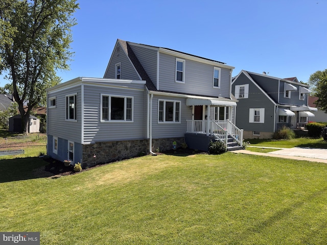 304 Nursery Rd, Linthicum Heights, MD 21090 - back of house with a lawn and roof with shingles