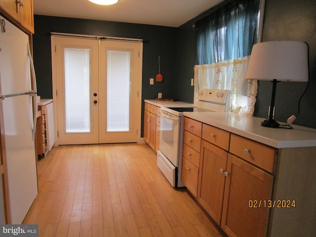 kitchen with white appliances, brown cabinetry, light countertops, french doors, and light wood-type flooring