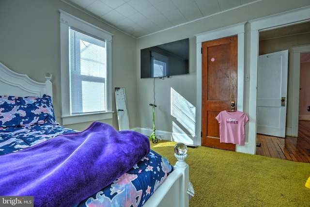 bedroom featuring wood finished floors