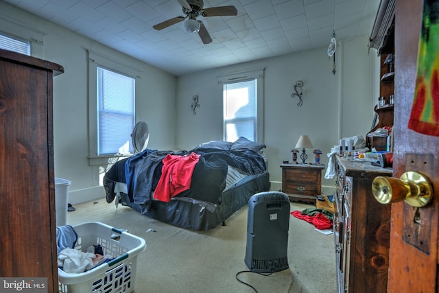 interior space featuring a ceiling fan and multiple windows