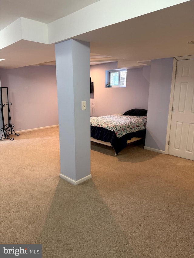 carpeted bedroom with baseboards