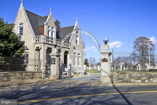 view of building exterior featuring fence