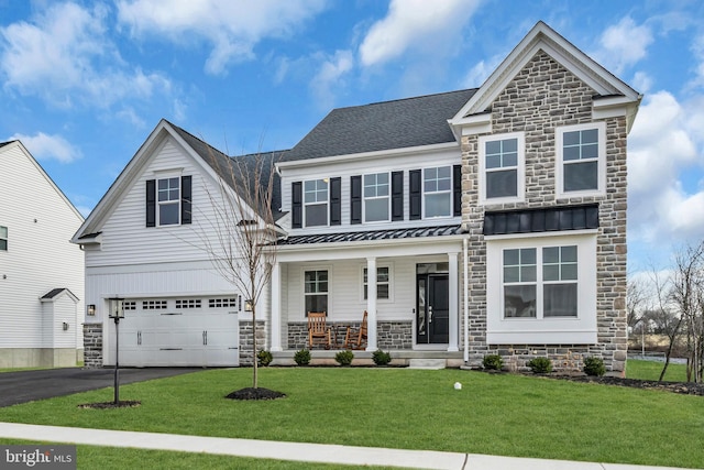 view of front of home with driveway, a garage, metal roof, a standing seam roof, and a porch