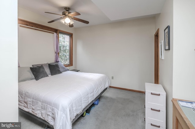 bedroom featuring baseboards, carpet floors, and ceiling fan