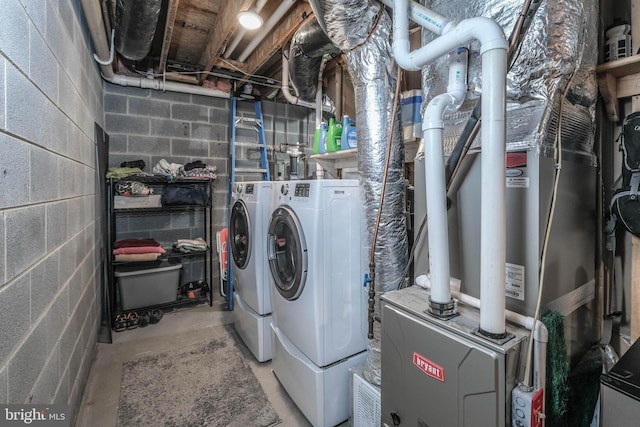 washroom with laundry area and washer and dryer