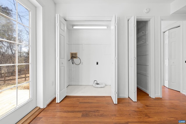 washroom with laundry area, washer hookup, hookup for an electric dryer, and wood finished floors