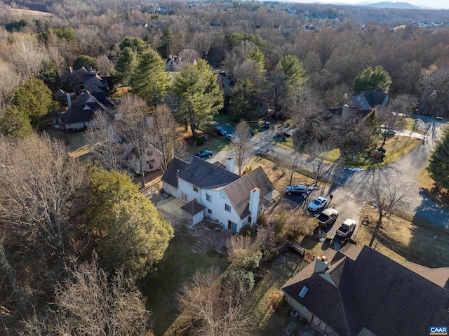 drone / aerial view featuring a forest view