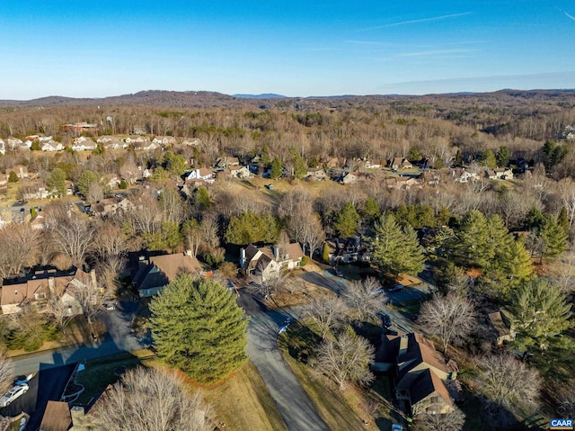 bird's eye view featuring a mountain view and a view of trees