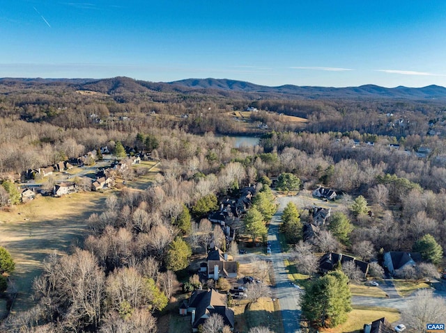 aerial view featuring a mountain view and a view of trees