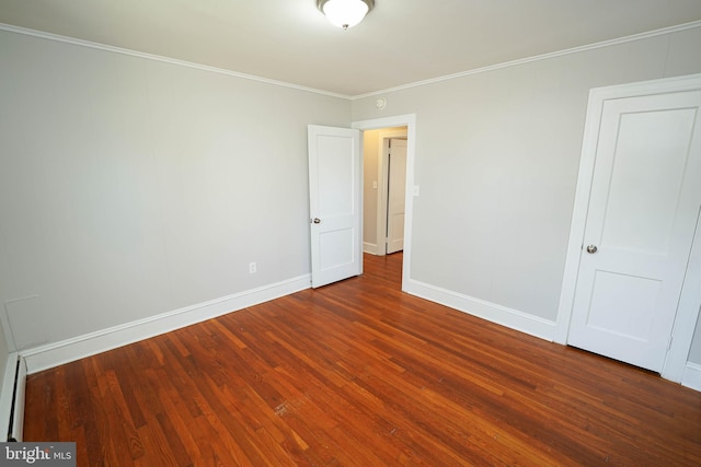 unfurnished bedroom with crown molding, baseboards, and wood finished floors