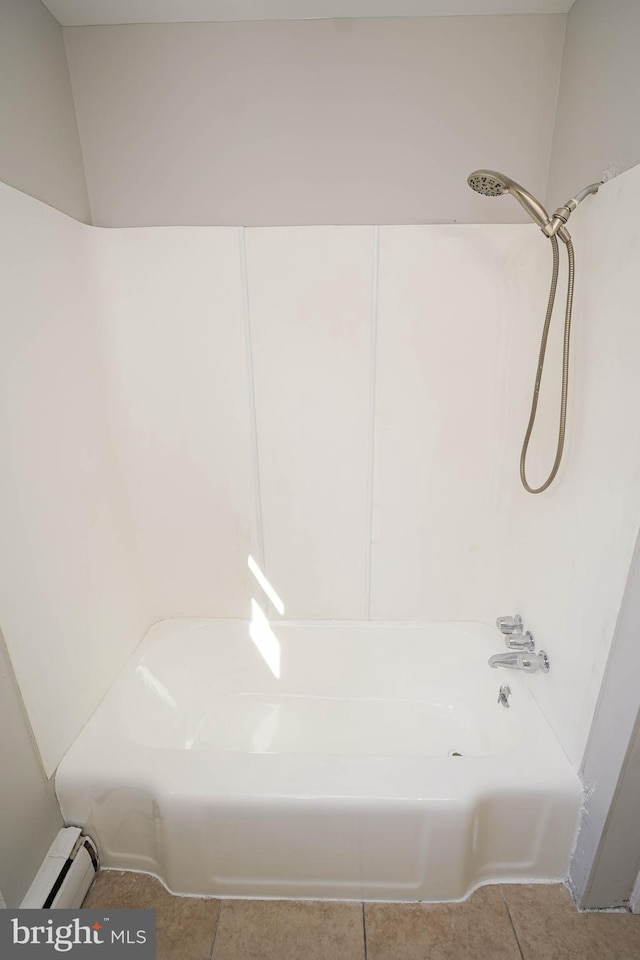 bathroom with a baseboard heating unit, shower / washtub combination, and tile patterned flooring