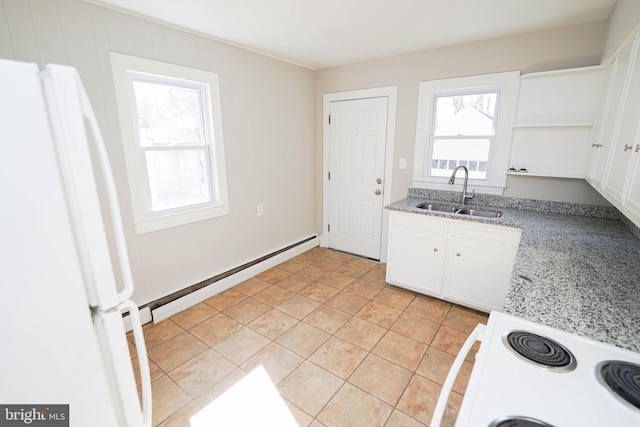 kitchen featuring a baseboard radiator, white appliances, light tile patterned flooring, and a sink