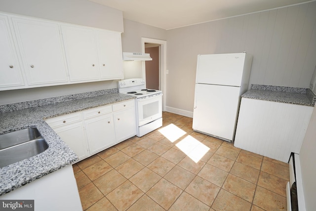 kitchen featuring white appliances, white cabinets, under cabinet range hood, a sink, and light tile patterned flooring