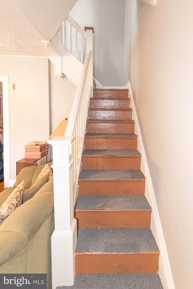 staircase with baseboards