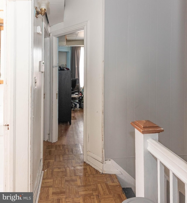 hallway with wooden walls