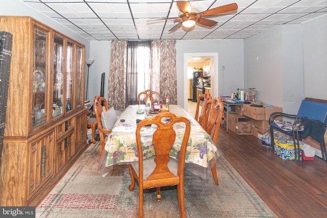 dining room with a ceiling fan and wood finished floors