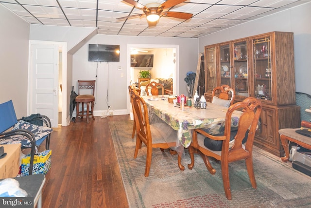 dining space featuring ceiling fan, baseboards, and wood finished floors