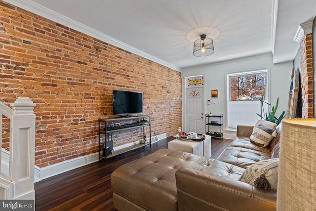 living area featuring brick wall, ornamental molding, wood finished floors, and baseboards