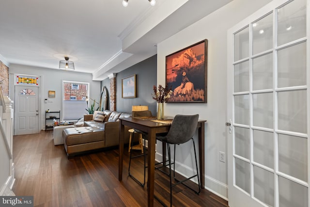 interior space with dark wood finished floors and baseboards