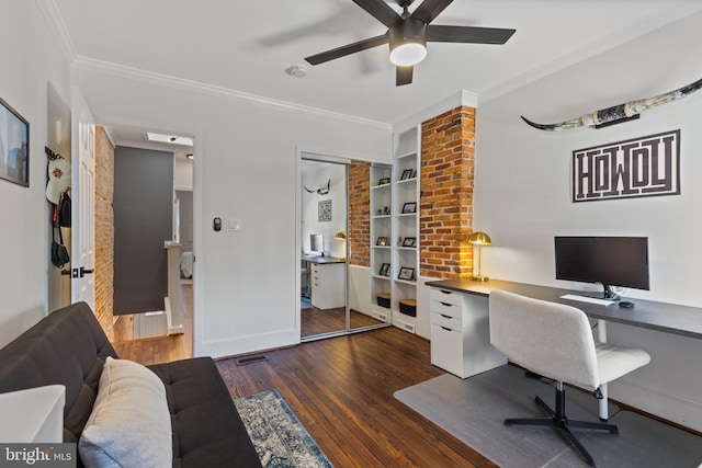 office featuring dark wood-style floors, built in shelves, crown molding, visible vents, and baseboards