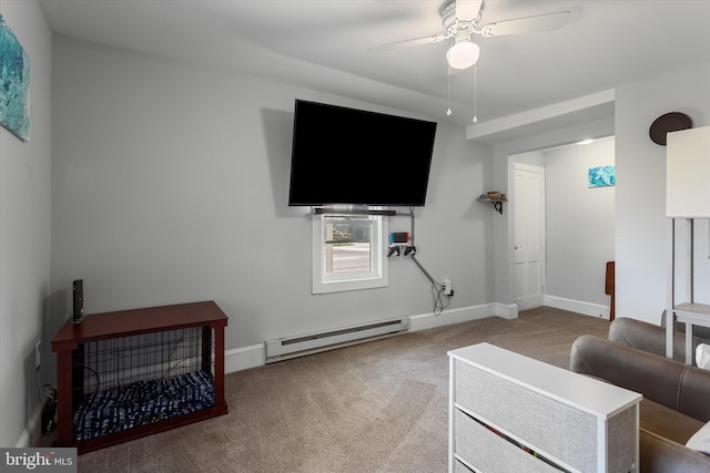 living area with carpet floors, a baseboard radiator, baseboards, and ceiling fan