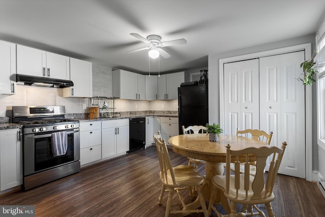 kitchen with black appliances, tasteful backsplash, dark wood finished floors, and under cabinet range hood