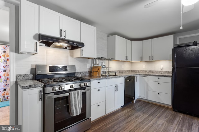 kitchen featuring under cabinet range hood, a sink, white cabinets, black appliances, and dark wood finished floors