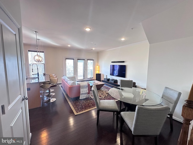 dining area with dark wood-style floors, recessed lighting, and ornamental molding