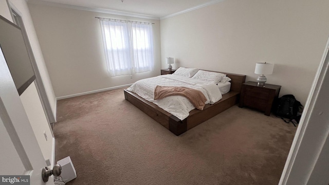 bedroom with baseboards, ornamental molding, and carpet flooring