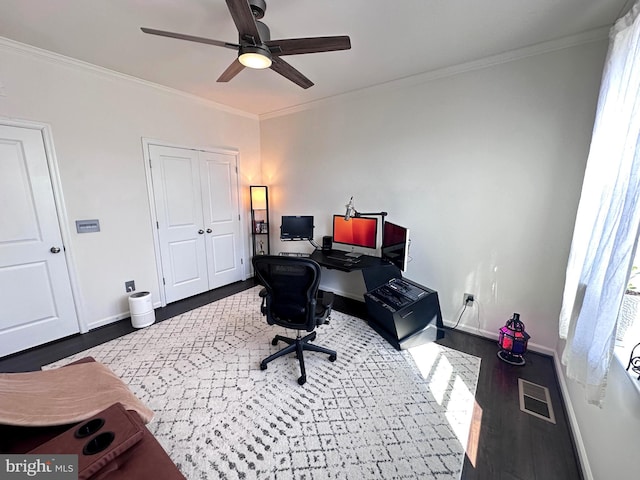 office space with visible vents, wood finished floors, and crown molding