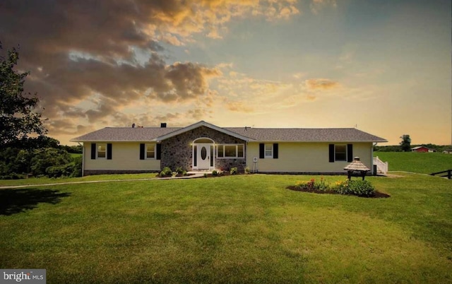 ranch-style house featuring a front lawn