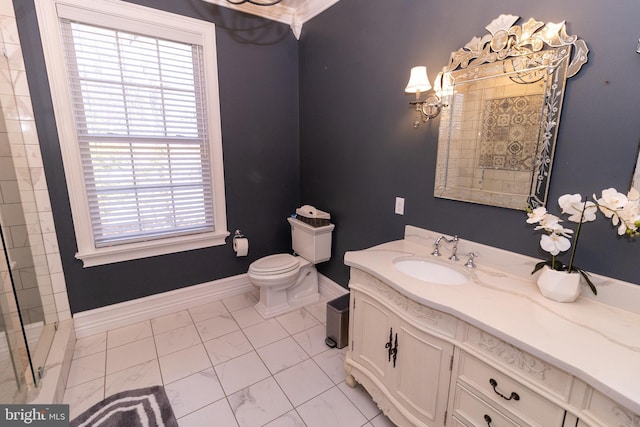full bathroom featuring toilet, vanity, and baseboards