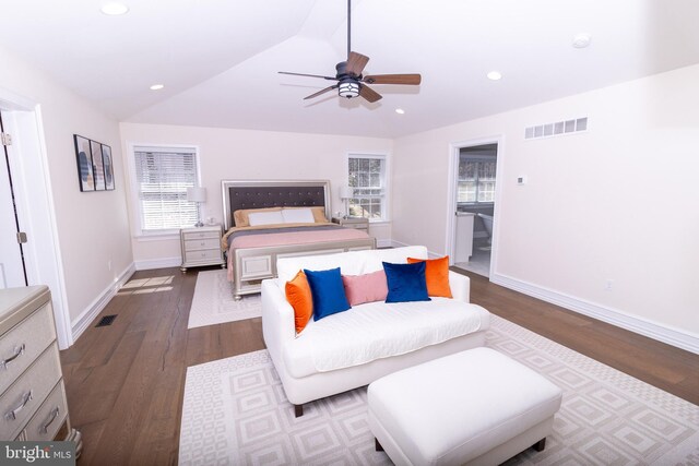 bedroom featuring visible vents, dark wood-type flooring, recessed lighting, baseboards, and lofted ceiling