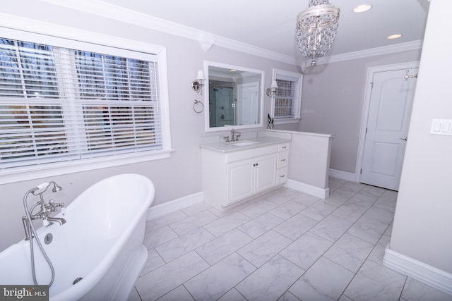 full bath featuring vanity, an inviting chandelier, a freestanding bath, ornamental molding, and marble finish floor