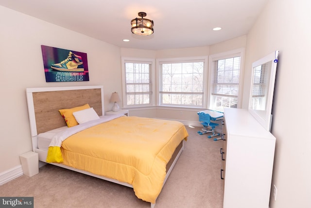 carpeted bedroom featuring recessed lighting and baseboards