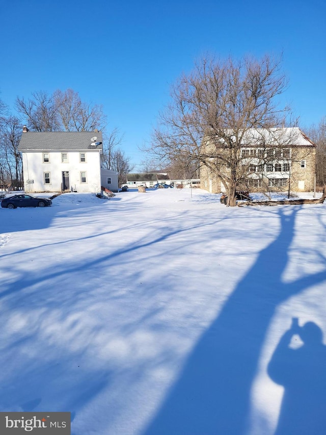 view of yard covered in snow