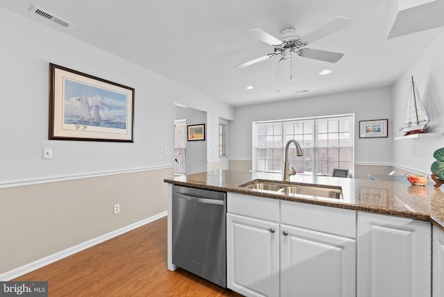 508 Limerick Cir Unit 304, Lutherville Timonium, MD 21093 - kitchen featuring a sink, dishwasher, white cabinets, dark stone counters, and light wood-style floors