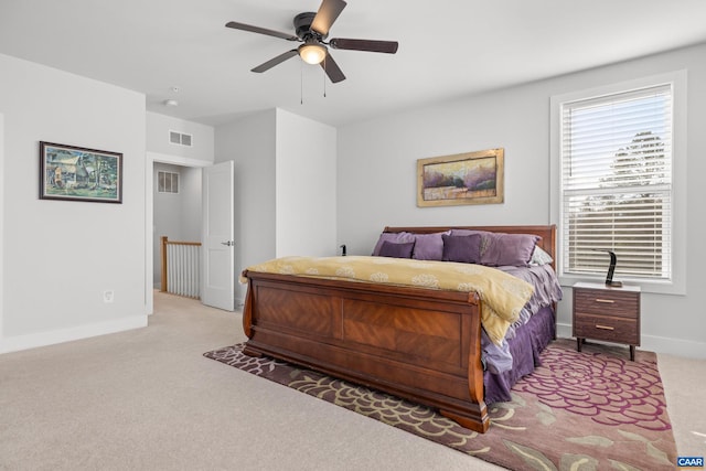 bedroom featuring a ceiling fan, carpet, visible vents, and baseboards