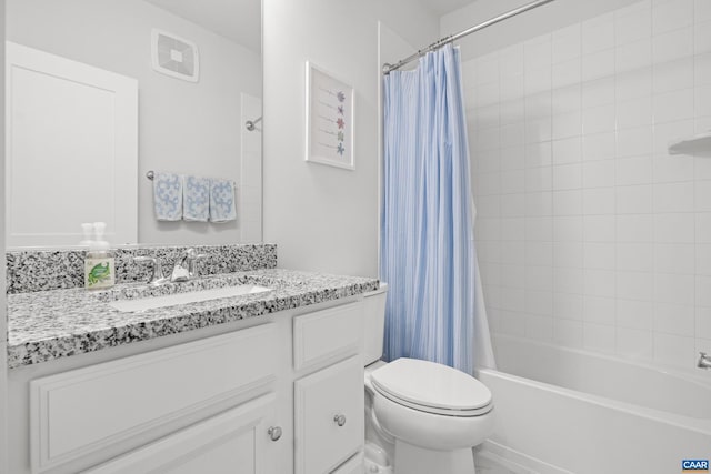 bathroom featuring toilet, shower / bath combination with curtain, and vanity