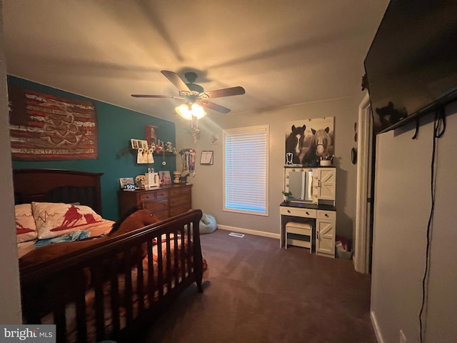 carpeted bedroom featuring a ceiling fan and baseboards