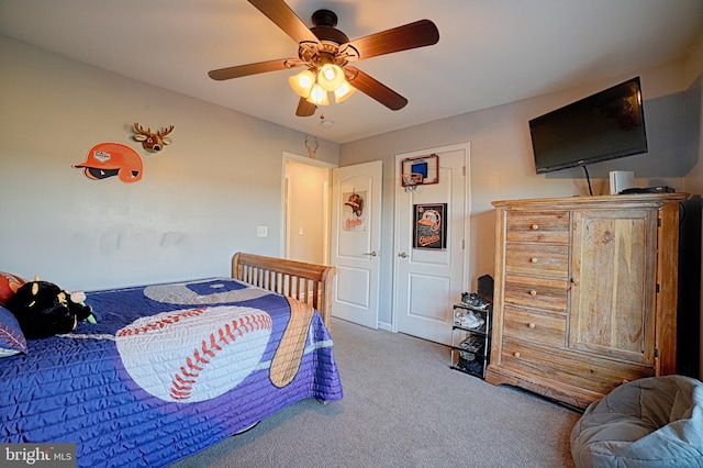 bedroom featuring ceiling fan and carpet flooring