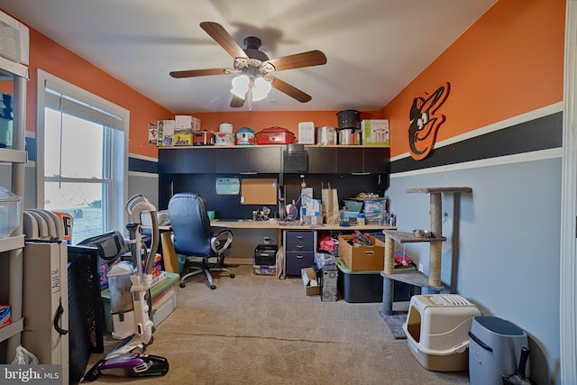 office with a ceiling fan and carpet