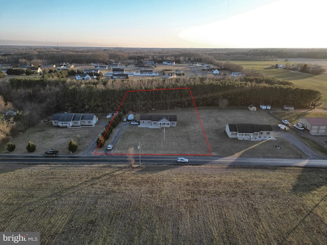 aerial view at dusk featuring a rural view