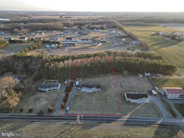 birds eye view of property featuring a rural view