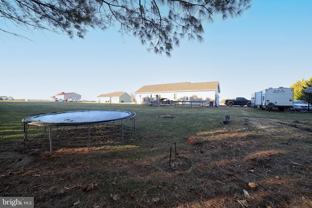 view of yard with a trampoline